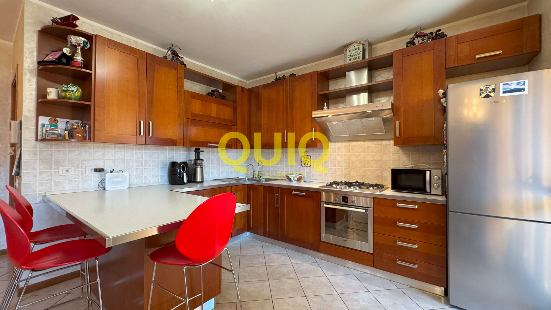 Valmadrera, trilocale al piano terra con box, cantina e doppio giardino